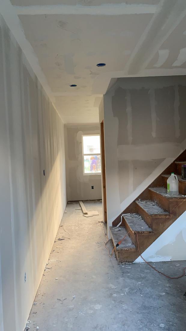 Finished corridor with drywall taped and sanded