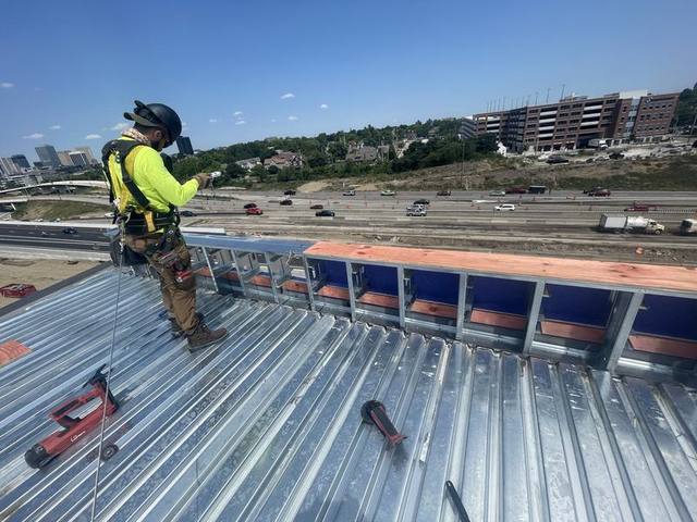 Metal deck and parapet framing above the highway