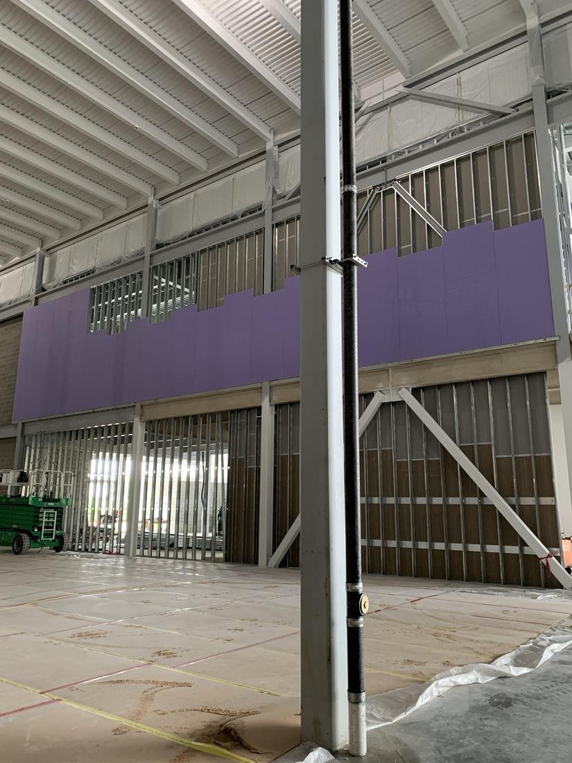 Fire-rated board hung on a high partition